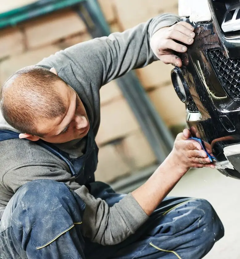 A person cleaning car