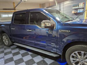 A view of a blue pickup truck